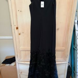 Beautiful black gown size 10.  Tickets still on.  From Saks 5th Ave NYC.